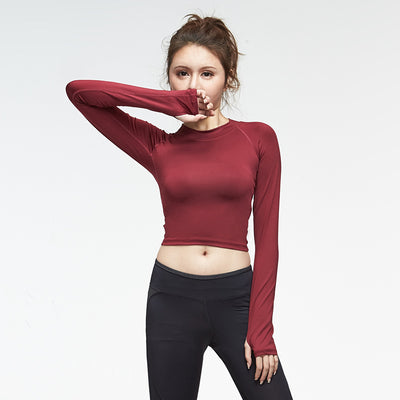 Hollowed-out back gym clothes in maroon with long sleeves, offering breathable comfort for workouts.
